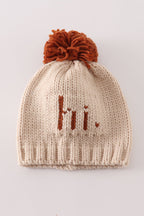 Beige pompom hi cable beanie hat