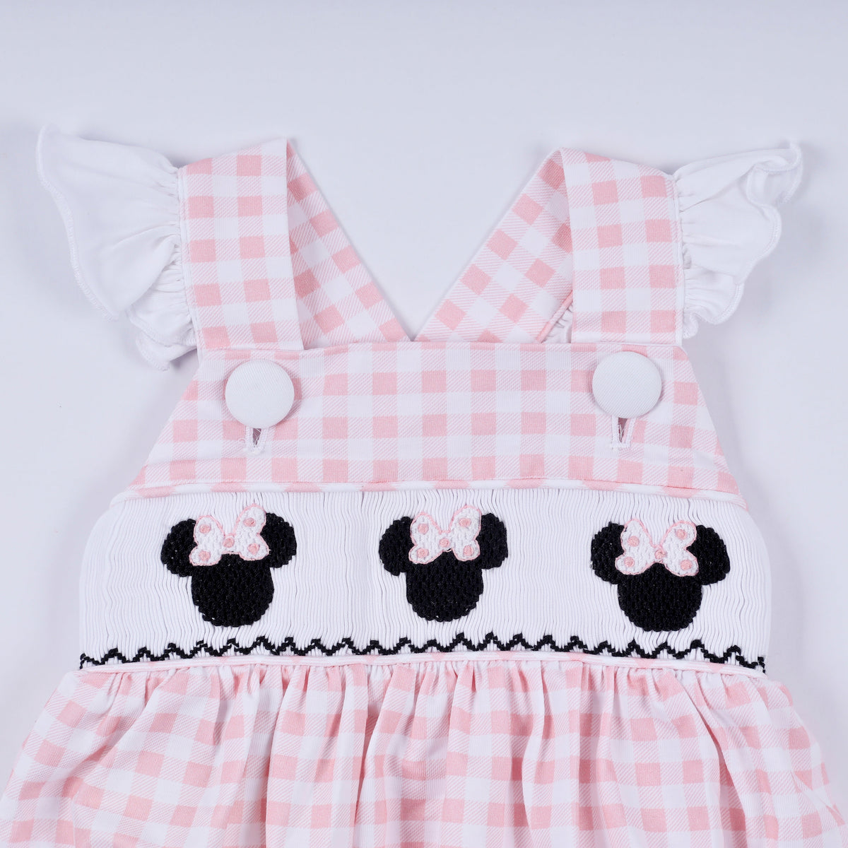 Pink character hand smocked gingham ruffle bubble