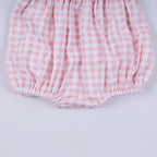 Pink character hand smocked gingham ruffle bubble